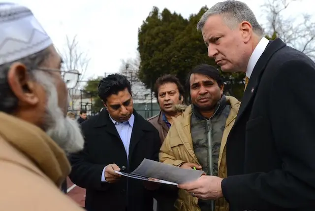 Mayor de Blasio speaks with the family of 8-year-old Noshat Nahian, who was killed crossing Queens Boulevard in December of 2013